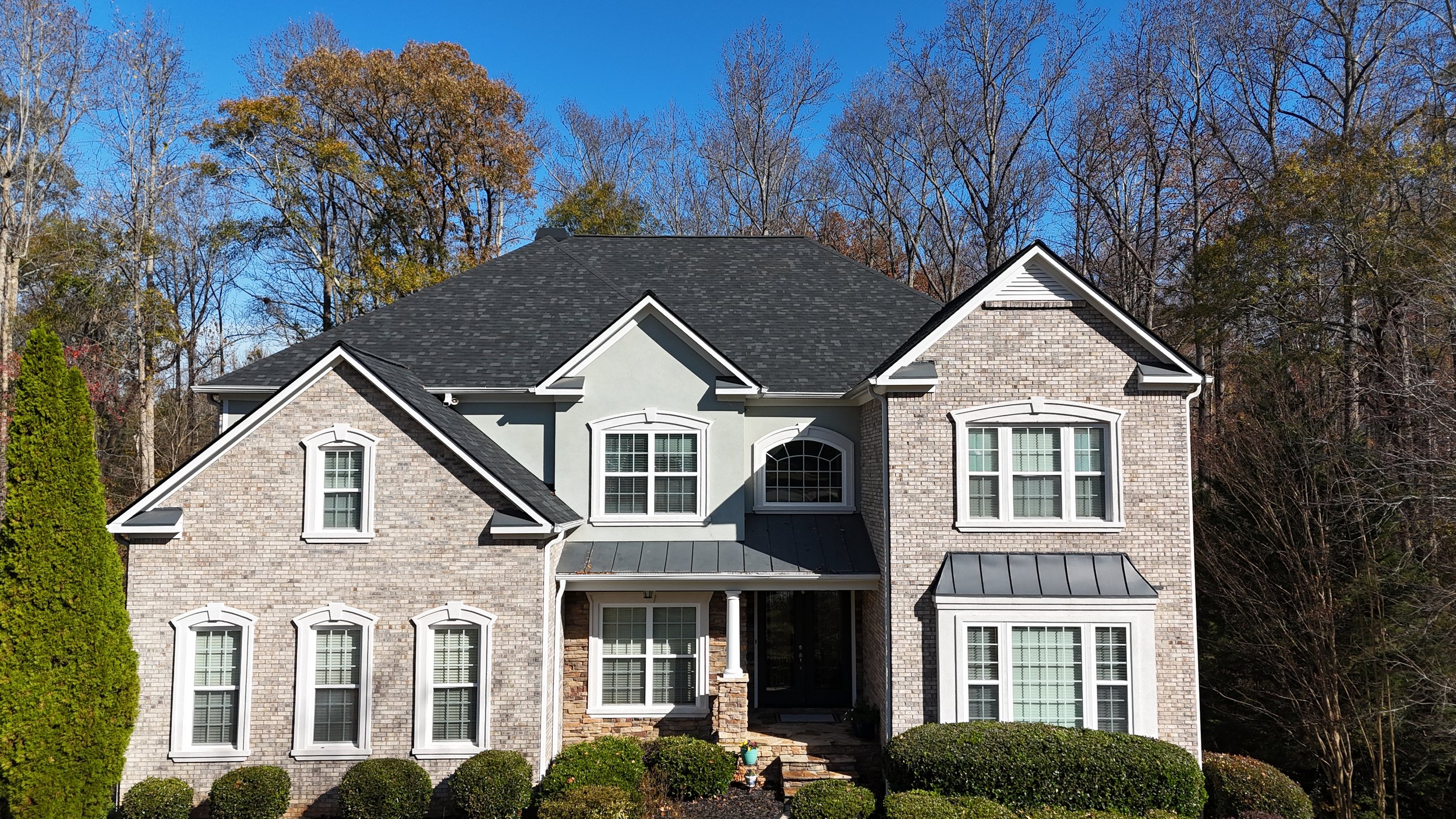 Aerial view of a newly replaced roof in metro Atlanta